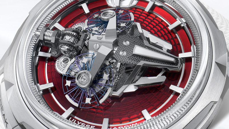 The Ulysse Nardin Freak S Enamel is available in ruby red and turquoise blue, with a titanium case and dual-oscillator movement visible under a domed sapphire crystal.