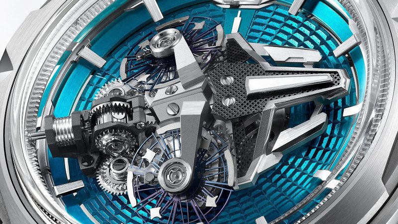 The Ulysse Nardin Freak S Enamel is available in ruby red and turquoise blue, with a titanium case and dual-oscillator movement visible under a domed sapphire crystal.
