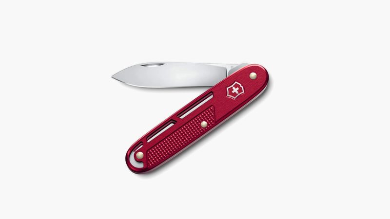 Victorinox Alox Refined Collection pocket knives in red, blue, and silver with skeletonized Alox scales and deep-carry clip.