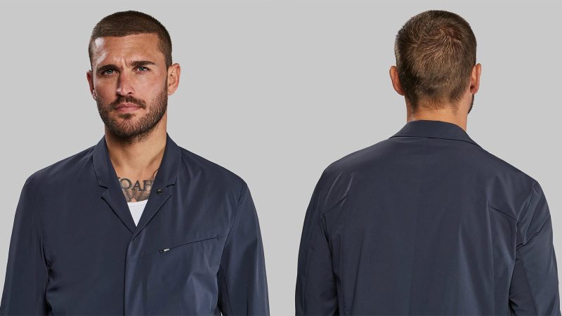 The Vollebak Neo Suit in black Cordura features four-way stretch, water repellence, and minimalist design with hidden zippers and articulated tailoring.