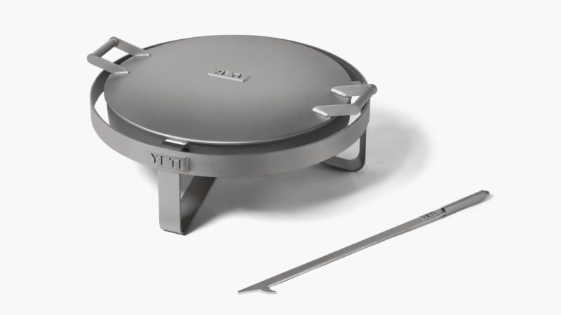 The YETI Fire Pit boasts a durable stainless steel design and an advanced airflow system, perfect for outdoor gatherings and cooking.