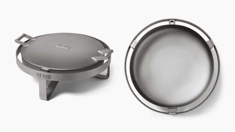 The YETI Fire Pit boasts a durable stainless steel design and an advanced airflow system, perfect for outdoor gatherings and cooking.