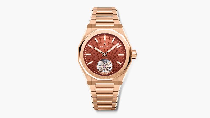 The Zenith DEFY Skyline Tourbillon in rose gold with brick-red dial and visible tourbillon aperture at 6 o’clock.