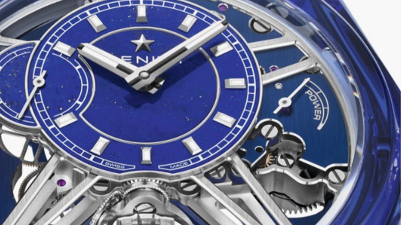 The Zenith Defy Zero G Sapphire watch features a transparent sapphire case, a gimbal-mounted escapement, and a lapis lazuli dial with celestial detailing.