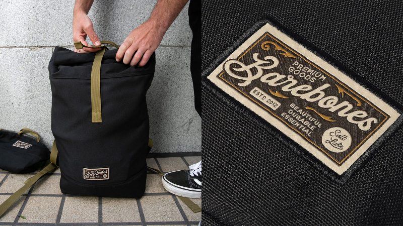 The Barebones Mōdeer Collection features a rolltop backpack, work tote, crossbody organizer, and zip pouch in recycled waxed canvas with metal hardware.