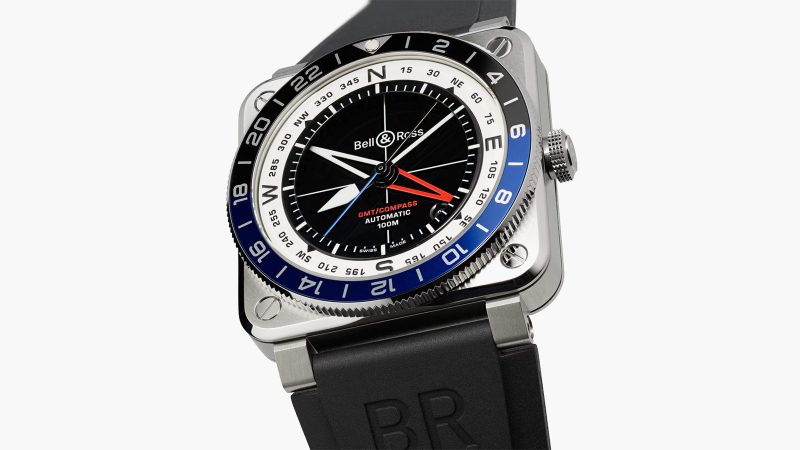 The Bell & Ross BR-03 GMT Compass watch with a square steel case, a black dial, a dual-color 24-hour bezel, and a red GMT hand.