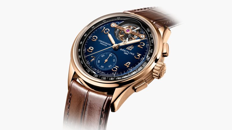 The Breitling Premier B21 Chronograph Tourbillon 42 Limited Edition shows a blue gradient dial and a gold tourbillon bridge.