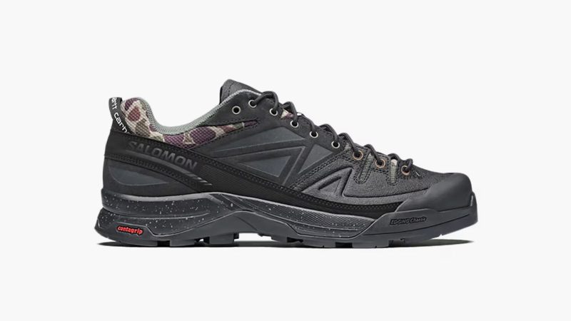 The Carhartt WIP x Salomon X-ALP is a black leather and synthetic trail sneaker with duck camo collar, rubber mudguard, and Utilitarian workwear flair.