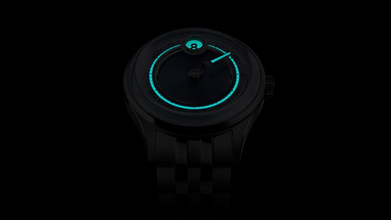 The Christopher Ward C1 Jump Hour Mk V watch with a glowing sapphire dial ring and jump hour display in Noon Blue.