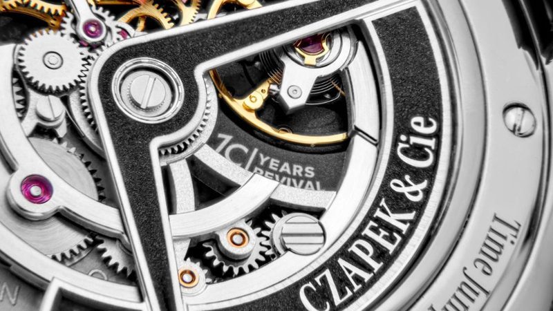 Czapek Time Jumper watch with jump-hour display, Singularité guilloché cover, caliber 10.01 movement, flying tourbillon, and stainless steel half-hunter case.