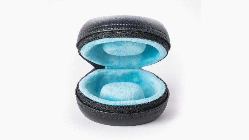 Discommon Goods The Puck watch case in wet-formed Napa leather, shown open and closed, highlighting its sculpted exterior and padded microfiber interior.