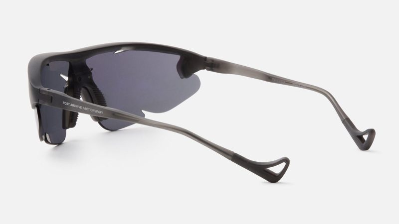 The District Vision x Post Archive Faction Junya Racer Sunglasses boast an ultralight wraparound frame, high-contrast performance lenses, futuristic sculptural design, and running-ready fit.