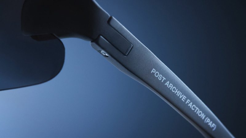 The District Vision x Post Archive Faction Junya Racer Sunglasses boast an ultralight wraparound frame, high-contrast performance lenses, futuristic sculptural design, and running-ready fit.