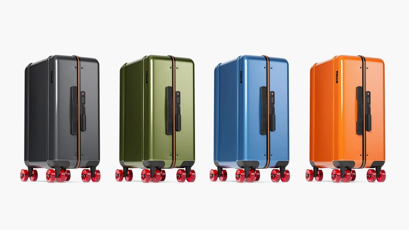 The Floyd Compact Carry-On retro-inspired polycarbonate hard-shell suitcase with skateboard wheels, bold color design, and organized interior travel compartments.