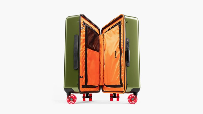 The Floyd Compact Carry-On retro-inspired polycarbonate hard-shell suitcase with skateboard wheels, bold color design, and organized interior travel compartments.