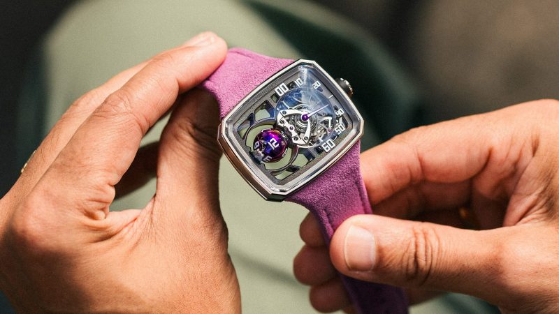 The Hautlence Sphere Series 3 titanium watch with purple spherical jumping hour complication and retrograde minutes on a suede strap.