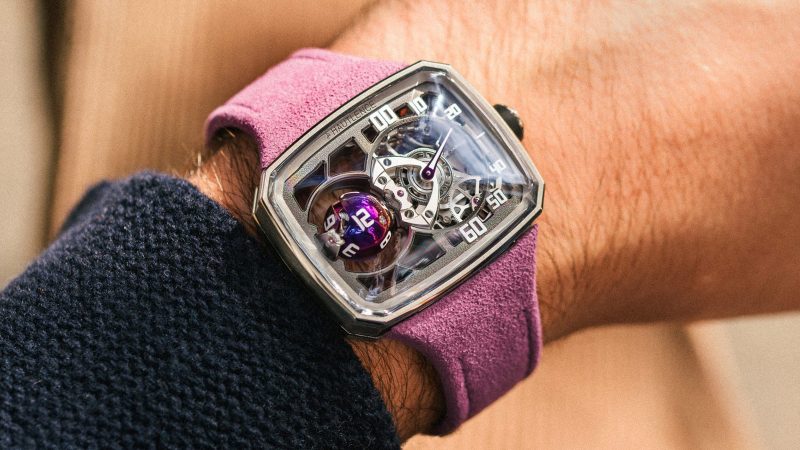 The Hautlence Sphere Series 3 titanium watch with purple spherical jumping hour complication and retrograde minutes on a suede strap.
