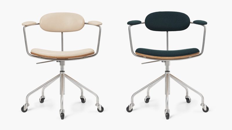 The Hans J. Wegner Swivel Chair, sculpted in wood and leather, showcases mid-century Danish design craftsmanship and ergonomic modern seating.