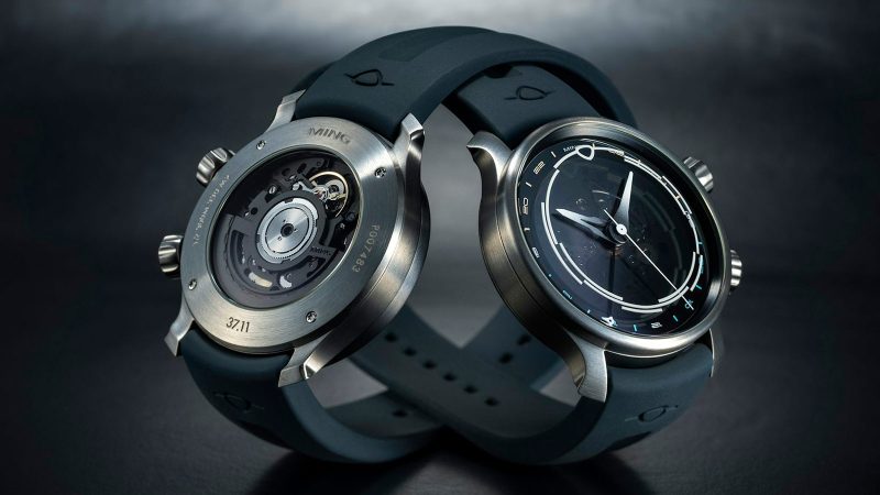 MING 37.11 Odyssey titanium GMT dive watch with smoked sapphire dial, rotating 24-hour ring, gradient-lumed hands, and titanium bracelet.