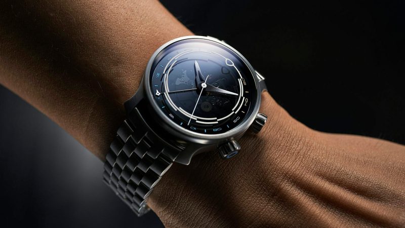 MING 37.11 Odyssey titanium GMT dive watch with smoked sapphire dial, rotating 24-hour ring, gradient-lumed hands, and titanium bracelet.