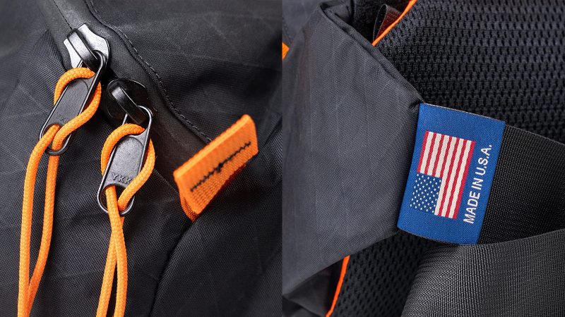 Mystery Ranch Hip Monkey 25 Legacy Edition waist pack in X-Pac sailcloth with orange trim, commemorative patch, and adjustable hip belt.