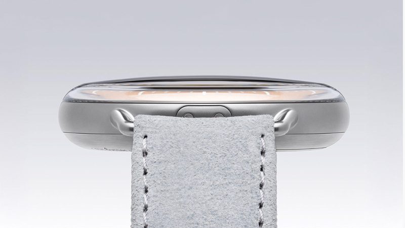 Ressence Type 1 Round Rose Gold limited-edition titanium watch with rose gold-plated dial, orbital ROCS display, and suede strap.