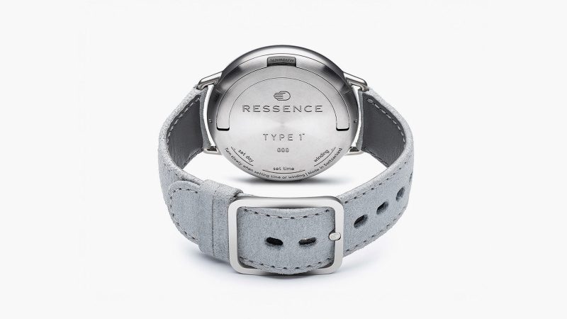 Ressence Type 1 Round Rose Gold limited-edition titanium watch with rose gold-plated dial, orbital ROCS display, and suede strap.