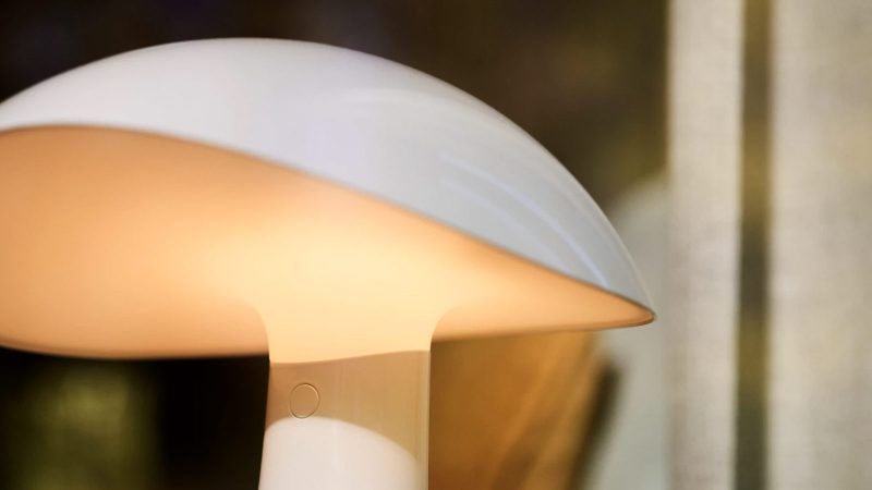 The Rumee 220 Portable Lamp in sculptural asymmetric form, designed by Gabriel Tan with soft ambient 360-degree glow.