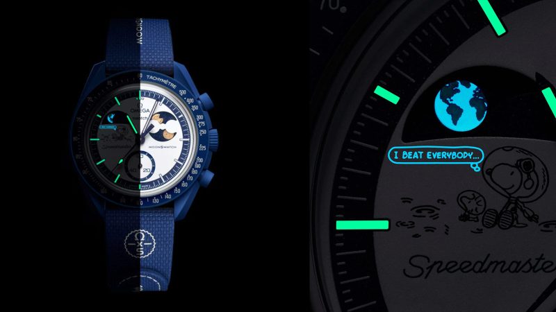 Navy SWATCH x Omega Mission to Earthphase Moonshine Gold Beaver Moon Edition watch with Earthphase, Moonshine Gold moonphase, Snoopy detail, and Bioceramic case.