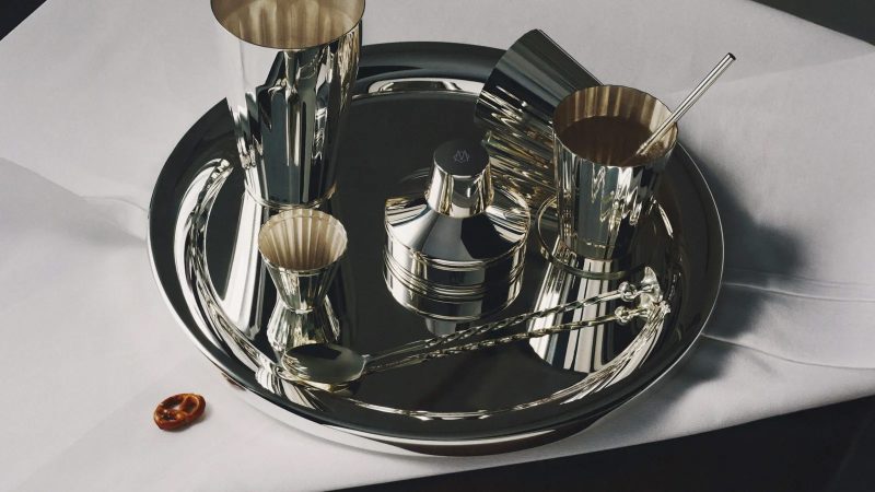 The RIMOWA x Robbe & Berking Cocktail Case features an aluminum shell, handcrafted silver bar tools, and a luxe travel mixology setup.