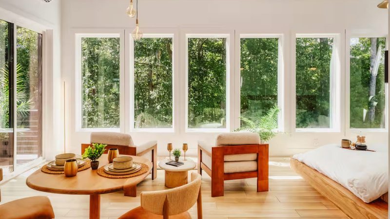 The Solenne Airbnb is a modern forest retreat features warm neutral tones, architectural clean lines, panoramic windows, and curated interior design.