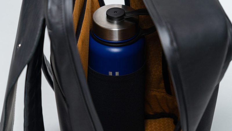 The WaterField Bowery Leather Backpack is handmade in San Francisco with full-grain leather, a magnetic Fidlock buckle, padded laptop and tablet compartments, water-resistant zippers, and a gold-lined interior.