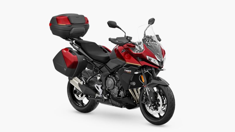 The 2026 Triumph Tiger Sport 800 Tour motorcycle with panniers, top case, 798cc triple engine, touring accessories, heated grips, comfort seat, TPMS, and Showa suspension.
