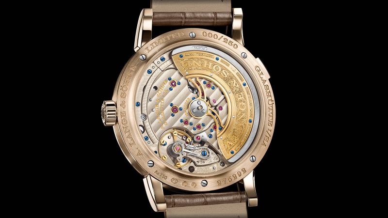 A. Lange & Söhne LANGE 1 DAYMATIC Honeygold limited edition watch featuring a Honeygold case, brown dial, retrograde day display, and caliber L021.1 movement.