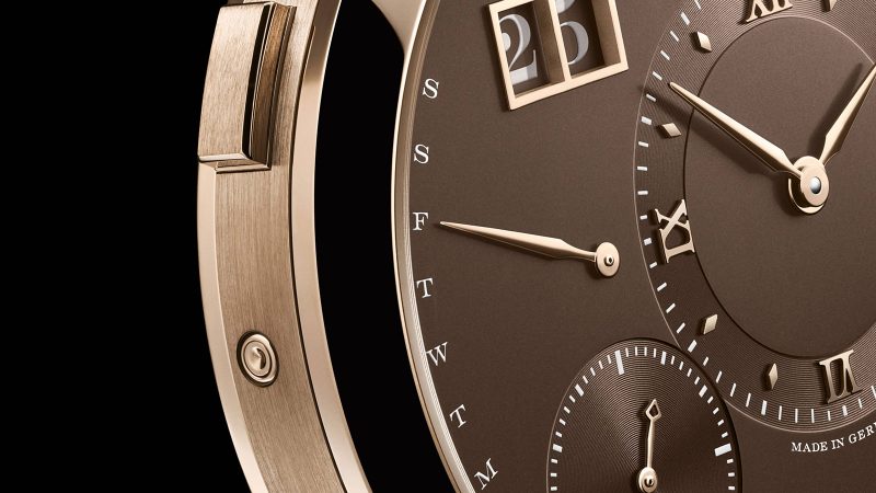 A. Lange & Söhne LANGE 1 DAYMATIC Honeygold limited edition watch featuring a Honeygold case, brown dial, retrograde day display, and caliber L021.1 movement.