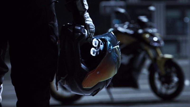 The Aegis Rider Vision motorcycle helmet features an integrated augmented reality HUD (Heads-Up Display) showing speed and navigation on the visor.