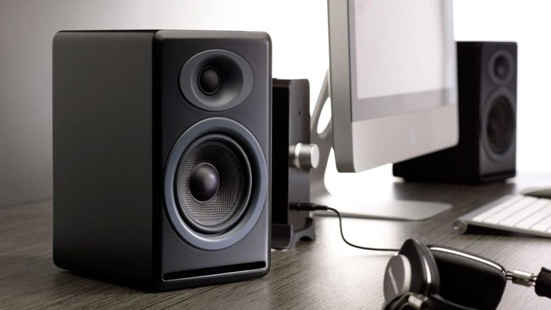 Audioengine Stereo Flex Kit featuring P4 passive speakers and N22 desktop amplifier with Bluetooth aptX, headphone amp, 4-ohm impedance, and modern wood or matte finishes.