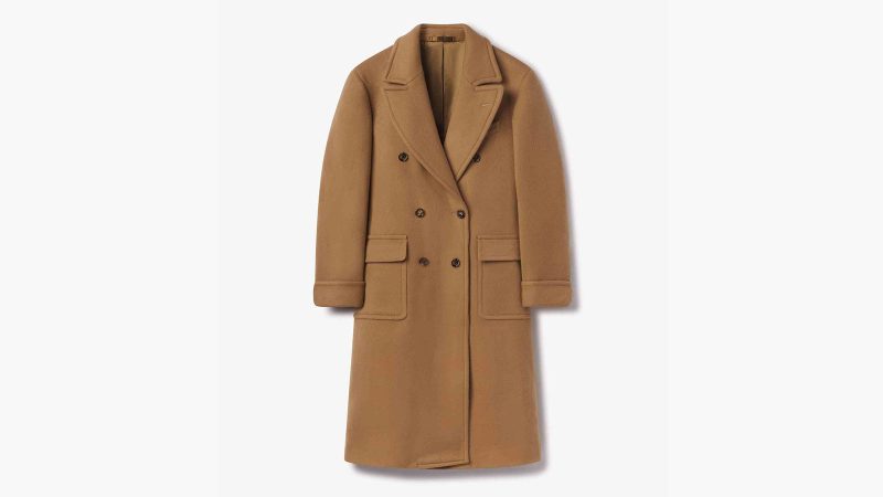 Buck Mason’s Camel Chukker Club Polo Coat in Italian wool features a double-breasted front, postbox pockets, and a classic tailored silhouette