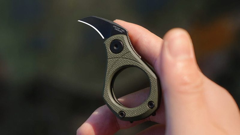 The CIVIVI Pyrus Slip Joint Utility Knife with 14C28N hawkbill blade, G10 ring handle, double-detent mechanism, sliding lock, ceramic bearings, and OD green finish.