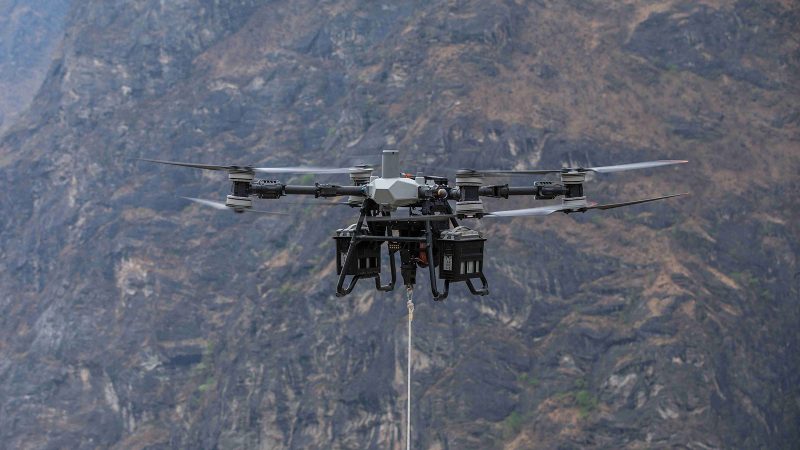 The DJI FlyCart 100 heavy-lift industrial drone with high payload capacity, dual-battery system, rugged modular design, and advanced aerial delivery capabilities.