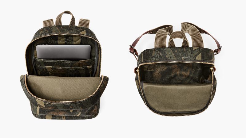 The Filson Workshop Rugged Twill Backpack in Maple Bark Camo with Harness Leather straps, brass zippers, padded back panel, and 15-inch laptop sleeve.