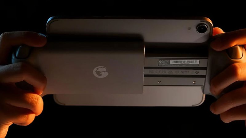 The GameSir G8 Plus MFi mobile controller in grey and black with an iPhone 16 docked, featuring Hall Effect thumbsticks and an extended stretch design.