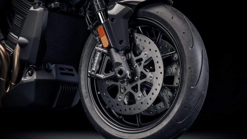 The 2026 Harley-Davidson Pan America 1250 ST motorcycle in Aurora Blue Denim features a blacked-out powertrain, 17-inch cast wheels, and a low smoked windshield.