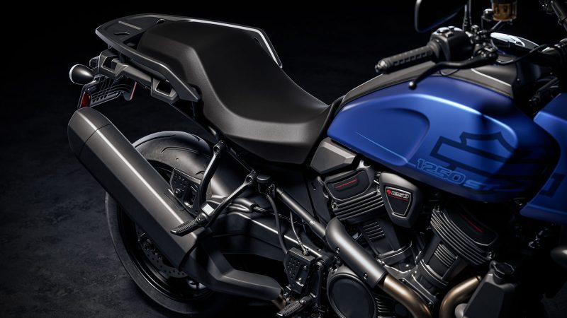 The 2026 Harley-Davidson Pan America 1250 ST motorcycle in Aurora Blue Denim features a blacked-out powertrain, 17-inch cast wheels, and a low smoked windshield.