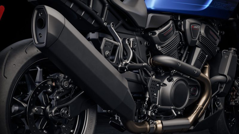 The 2026 Harley-Davidson Pan America 1250 ST motorcycle in Aurora Blue Denim features a blacked-out powertrain, 17-inch cast wheels, and a low smoked windshield.