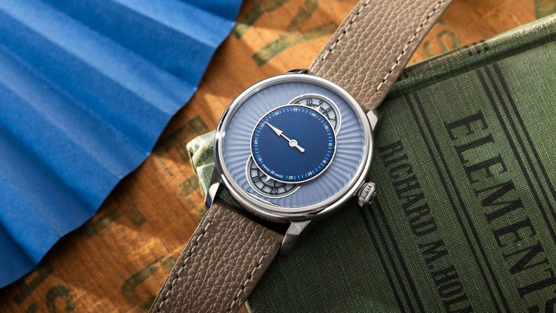 The Louis Erard x Worn & Wound Le Régulateur watch features a layered blue regulator dial, a polished steel case, Swiss automatic movement, and is a limited edition.