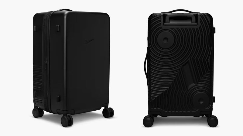 Nike’s 29-inch and 26-inch hardshell luggage in matte black featuring embossed Swoosh logo, multi-directional spinner wheels, and telescopic handles.