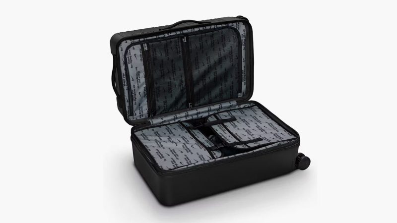 Nike’s 29-inch and 26-inch hardshell luggage in matte black featuring embossed Swoosh logo, multi-directional spinner wheels, and telescopic handles.