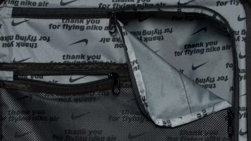 Nike’s 29-inch and 26-inch hardshell luggage in matte black featuring embossed Swoosh logo, multi-directional spinner wheels, and telescopic handles.