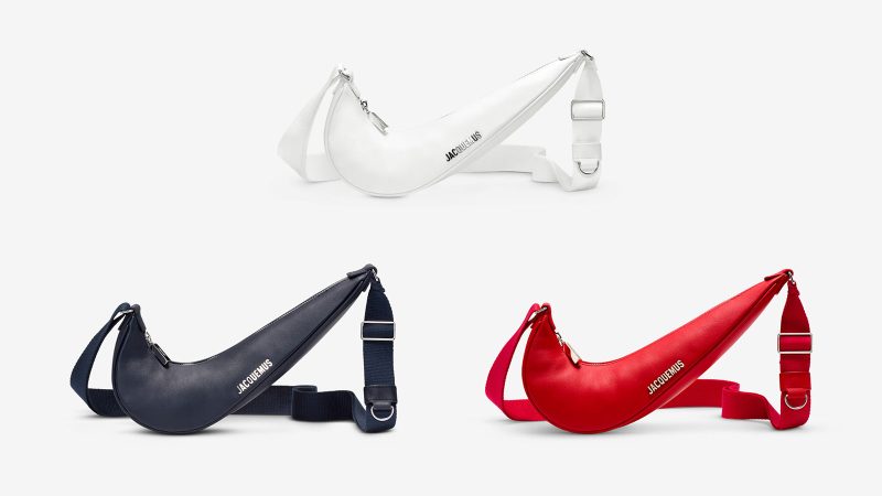 The Nike x Jacquemus Le Swoosh Crossbody Bag in premium leather shaped like the Nike logo with a silver-tone adjustable webbed shoulder strap.